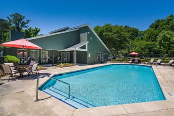 Sparkling Pool & Sundeck With Clubhouse Overlooking